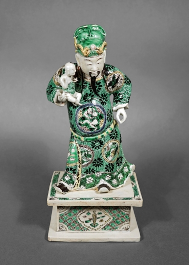 Famille Verte Porcelain Figure of an Immortal Holding a Child